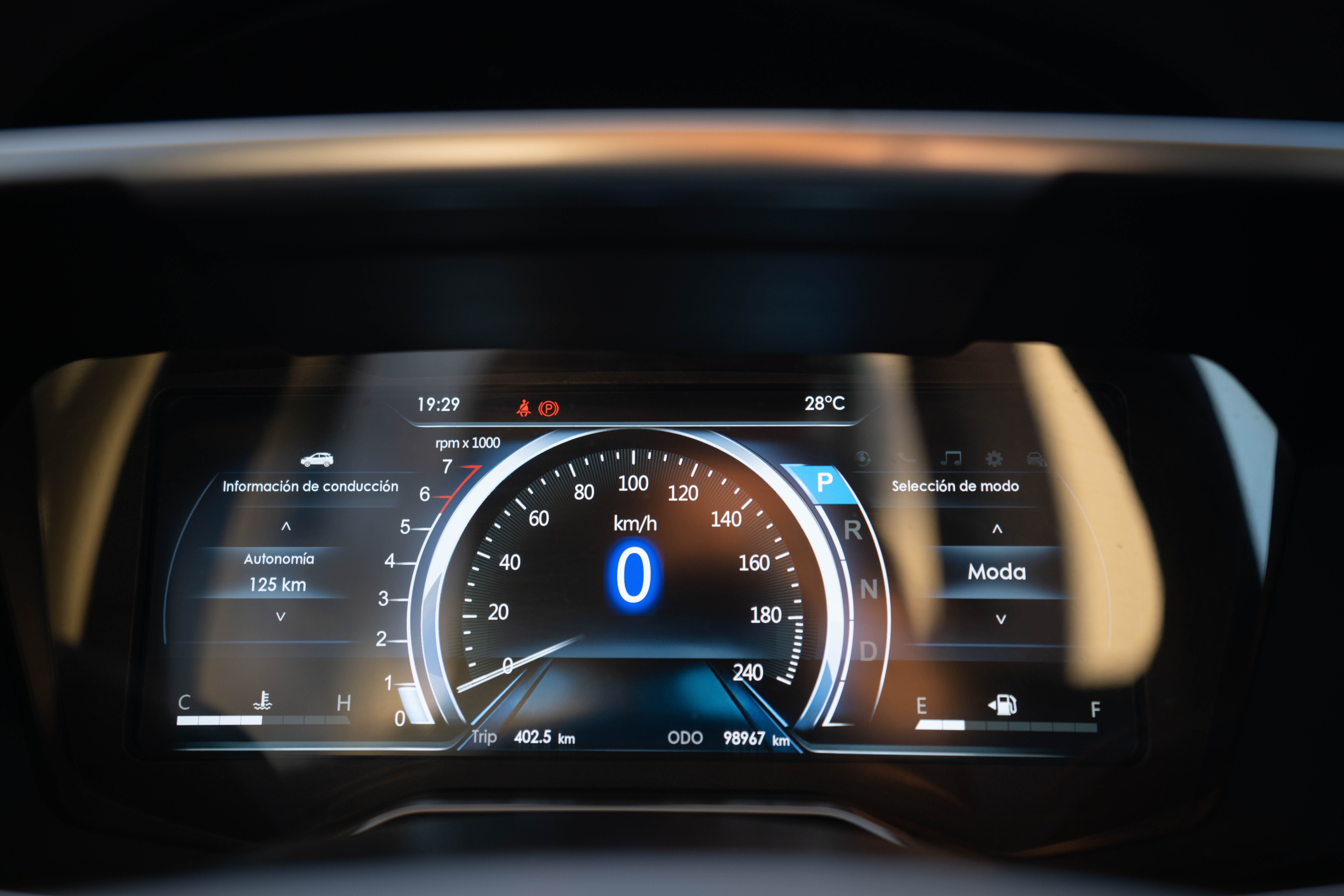 A fleet manager reviewing a telematics dashboard that displays speed, idle time, and safety events for a mixed fleet of tractor‑trailers
