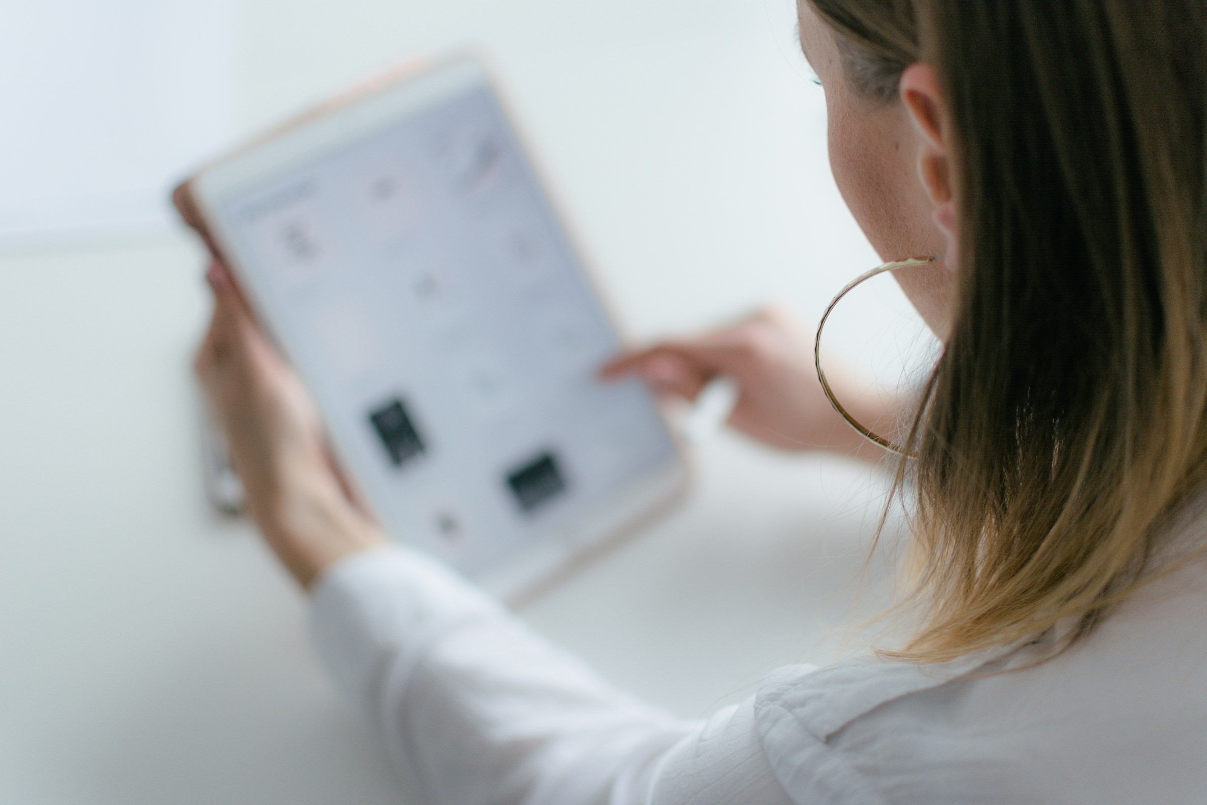 First-time homebuyer comparing mortgage rates on a tablet.